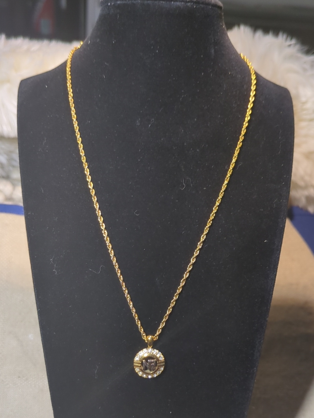 Nina Ricci Gold-Tone Round Pendant Necklace with Clear Accents Low Price $75